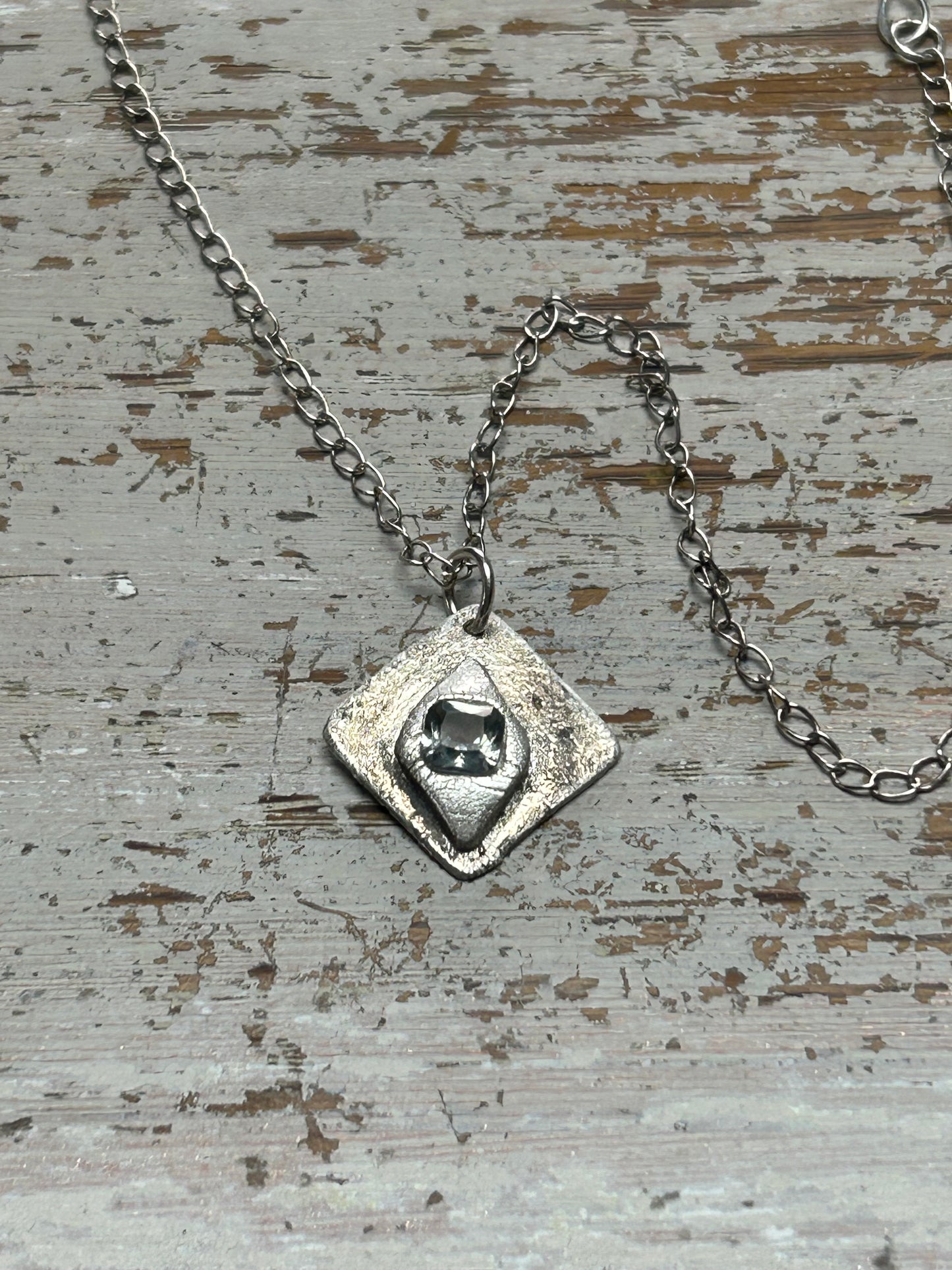 Fine Silver Pendant with Faceted Blue Stone