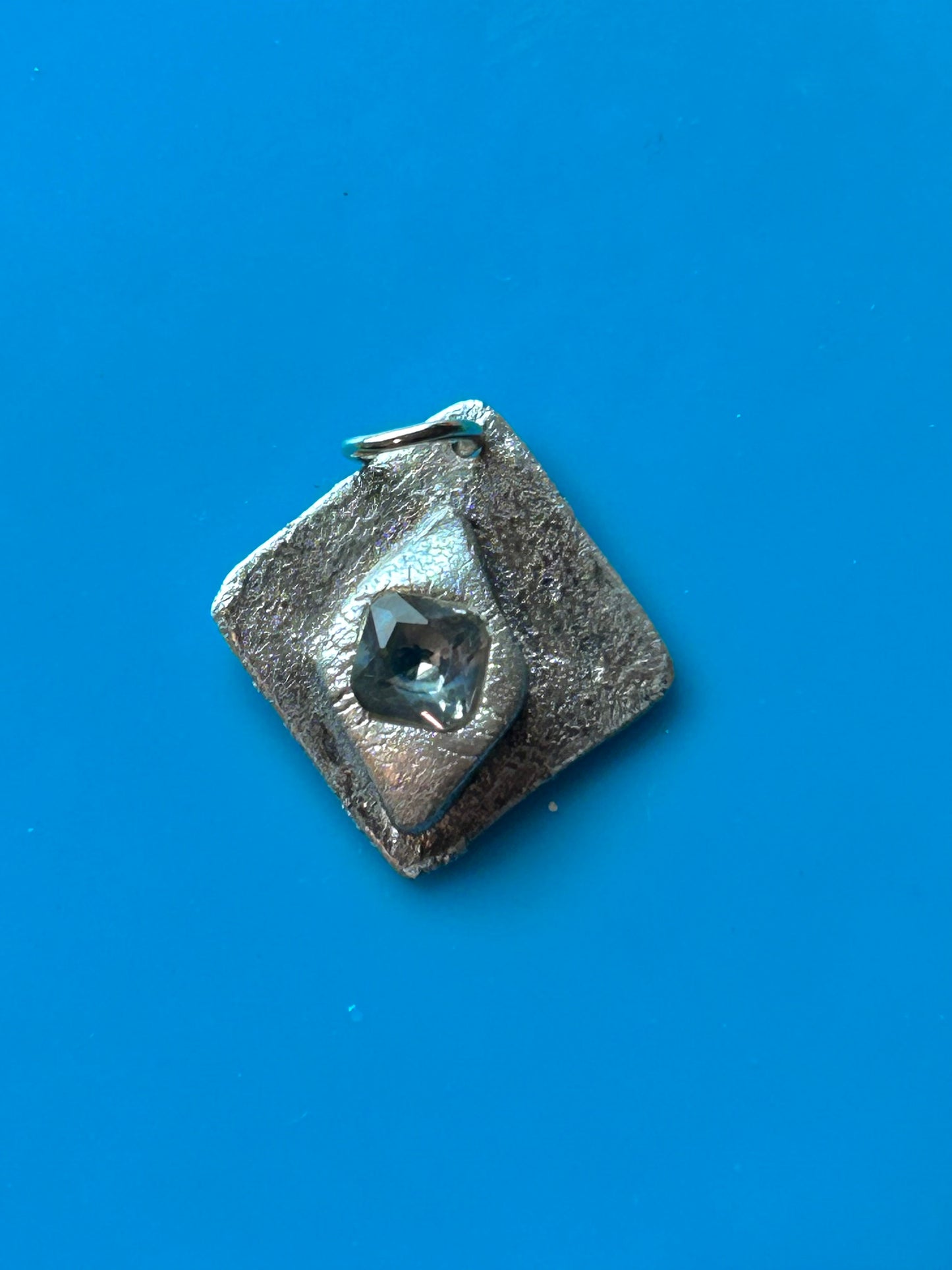 Fine Silver Pendant with Faceted Blue Stone