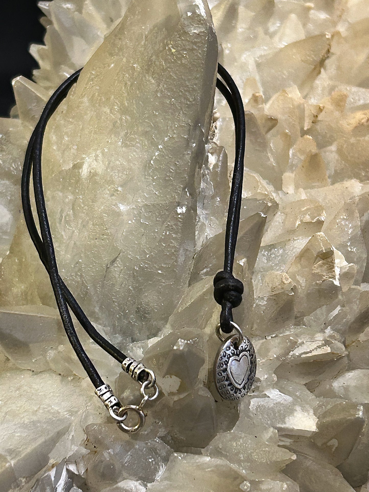 Leather necklace with fine silver heart