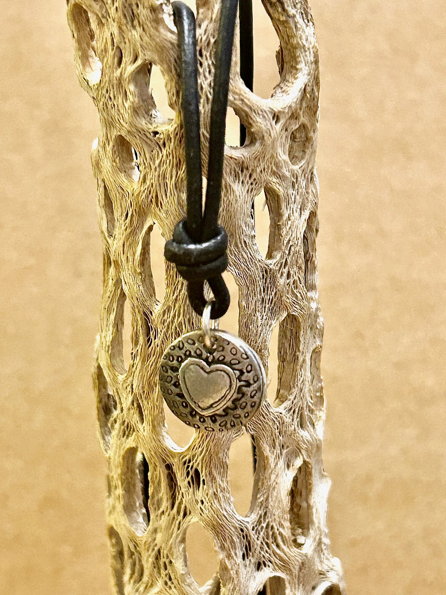 Leather necklace with fine silver heart